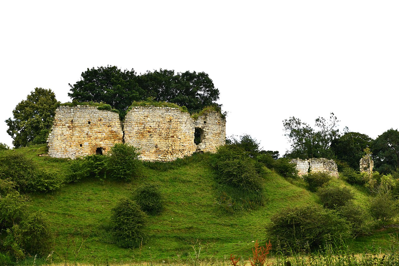 Mitford, Late c11th motte and bailey castle converted into a shell keep in c12th